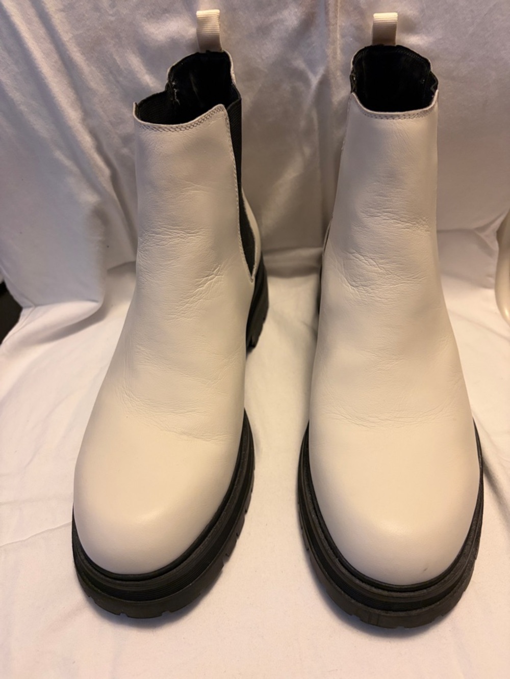 White leather Marc Fisher Chelsea boots.